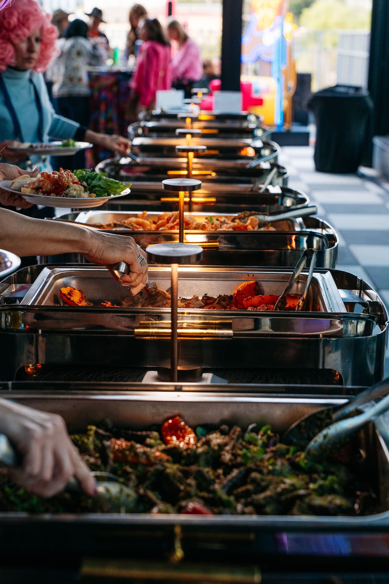 Guests moving through a chef-attended station line