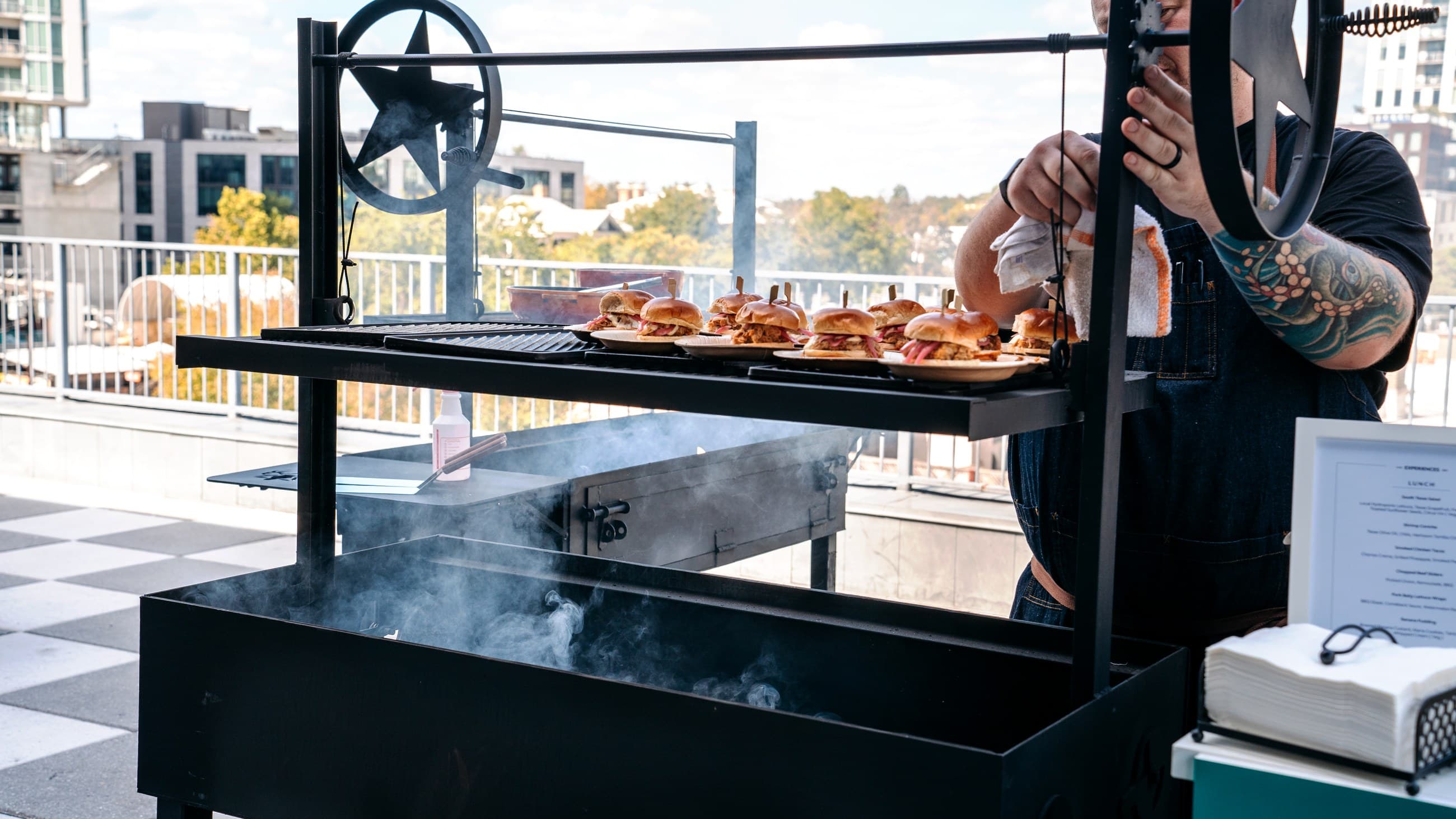 Sliders coming off a grill on a sunny patio